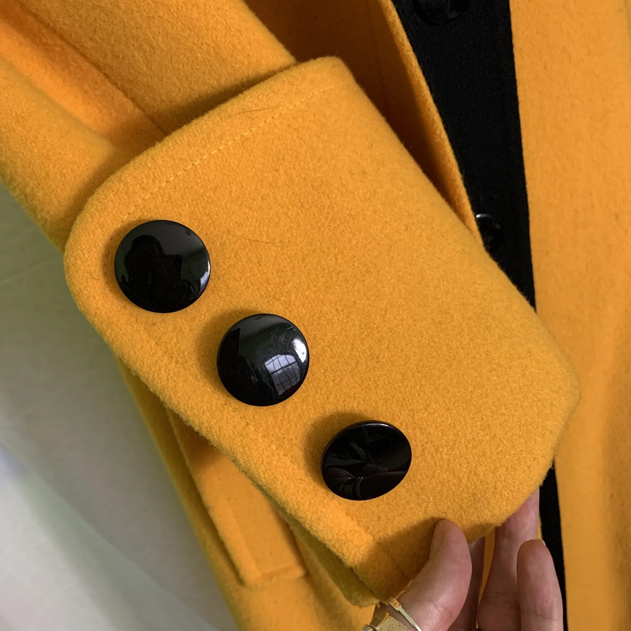 1980s Yellow Wool Coat by Ilie Wacs. Bold and Oversized with Black Collar and Button Accents.